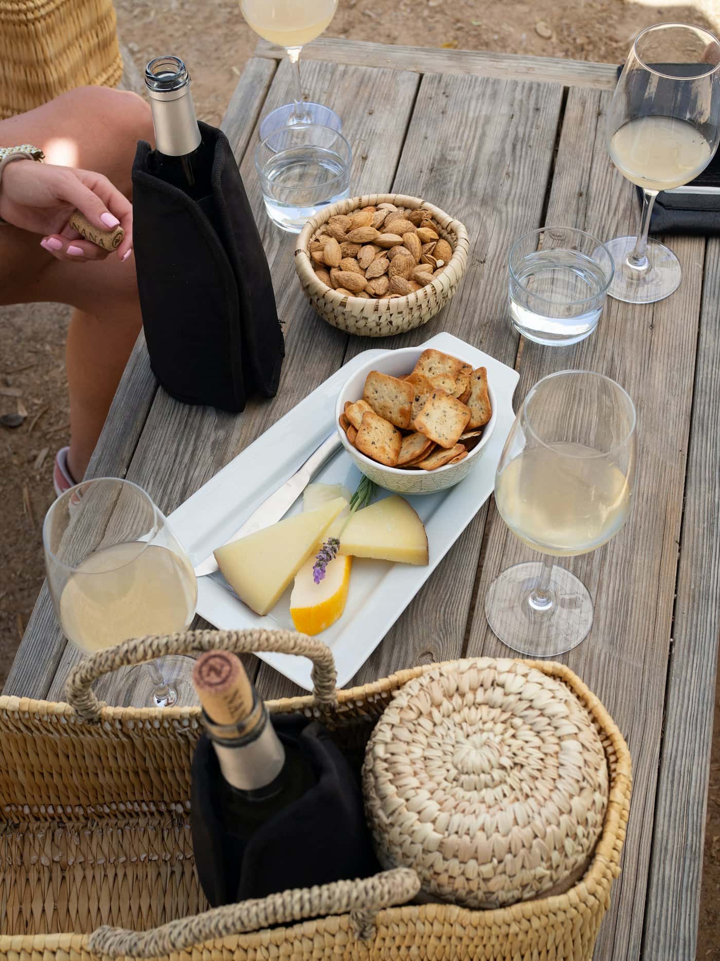 Wine glasses and pairing snacks arranged on a tasting table