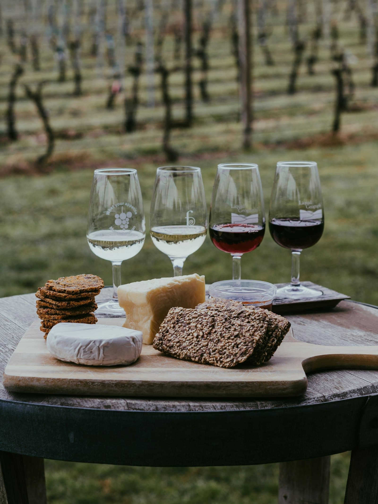 Wine glasses and a cheese board arranged for a pairing tasting.