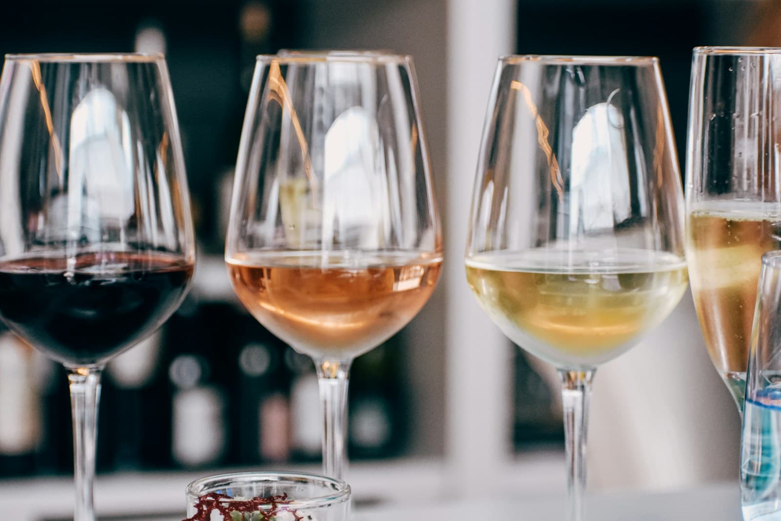 Red, rosé, and white wines arranged for a side-by-side tasting